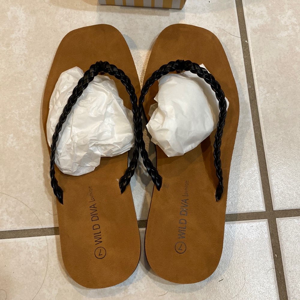 New in box black flip flops size 7